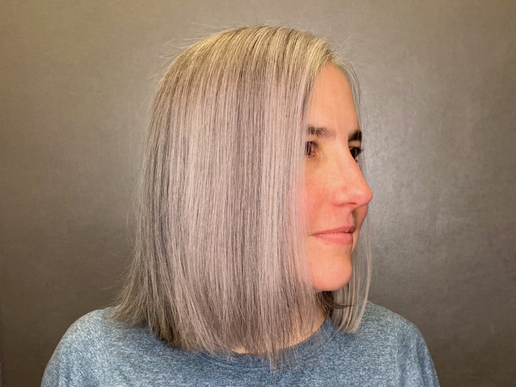 woman with grey transformation hair in salon