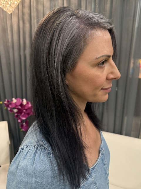 woman with ash brown and silver colored hair in salon