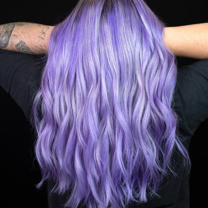 woman with light purple curly hair in salon pulp riot