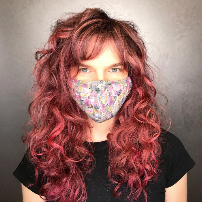 middle aged woman with curly red hair in salon