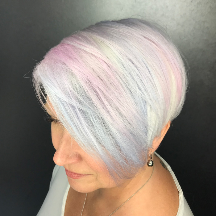 woman with dyed white and light blue hair in salon