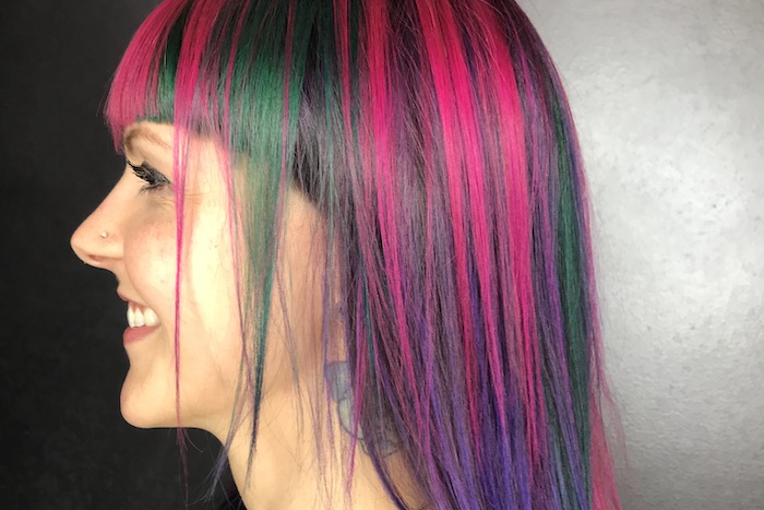woman with bangs and multi-colored hair