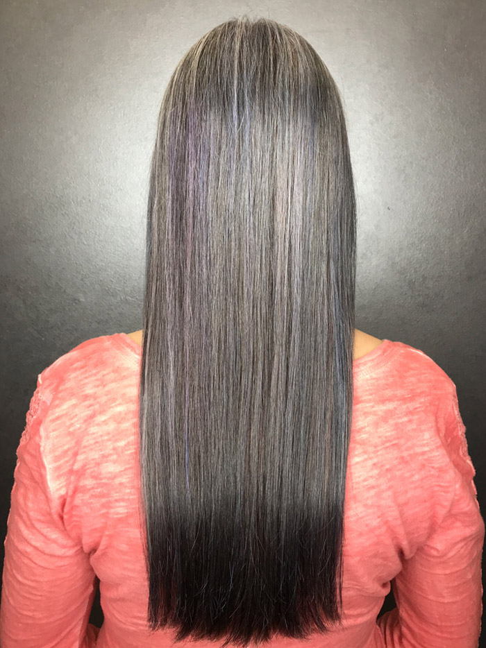 woman with long straight grey hair transformation in salon